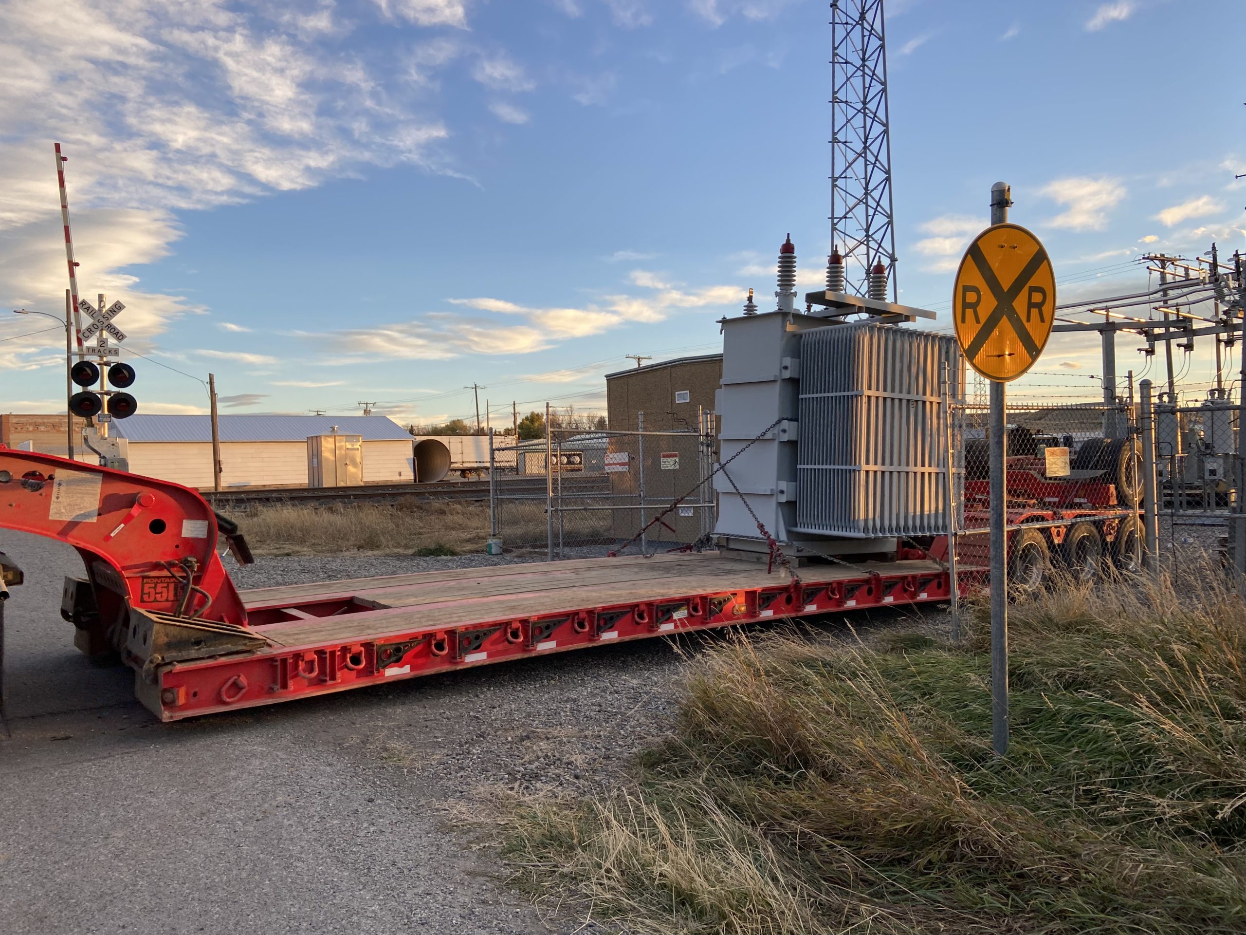 Power transformer being moved through the use of a skidding system.