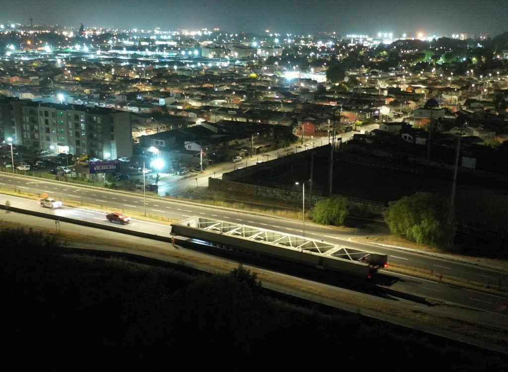 Drone shot of SPMT being utilized to transport a section of bridge.