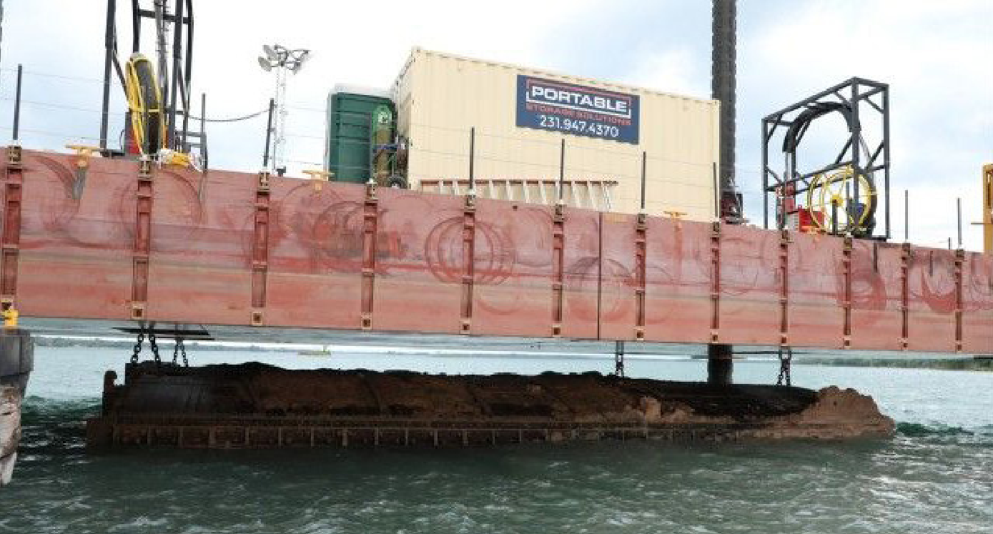 Strand jacks being used to raise the platform out of the mud to lift each gate.