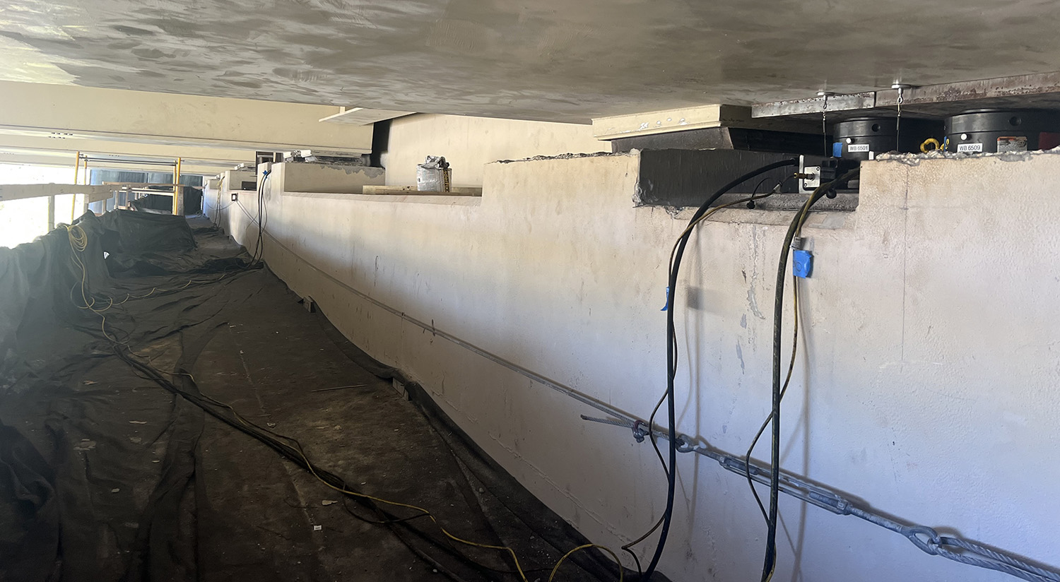 Under bridge view of cylinders at work.