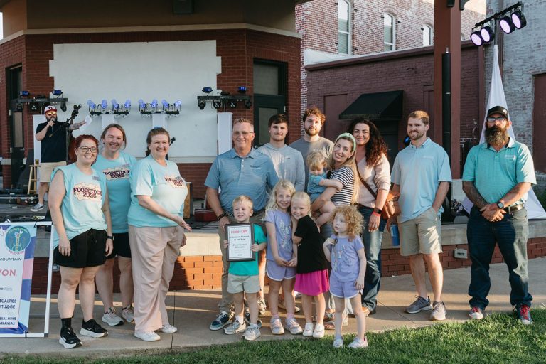Group of people accepting the award presentation at Foodstock.