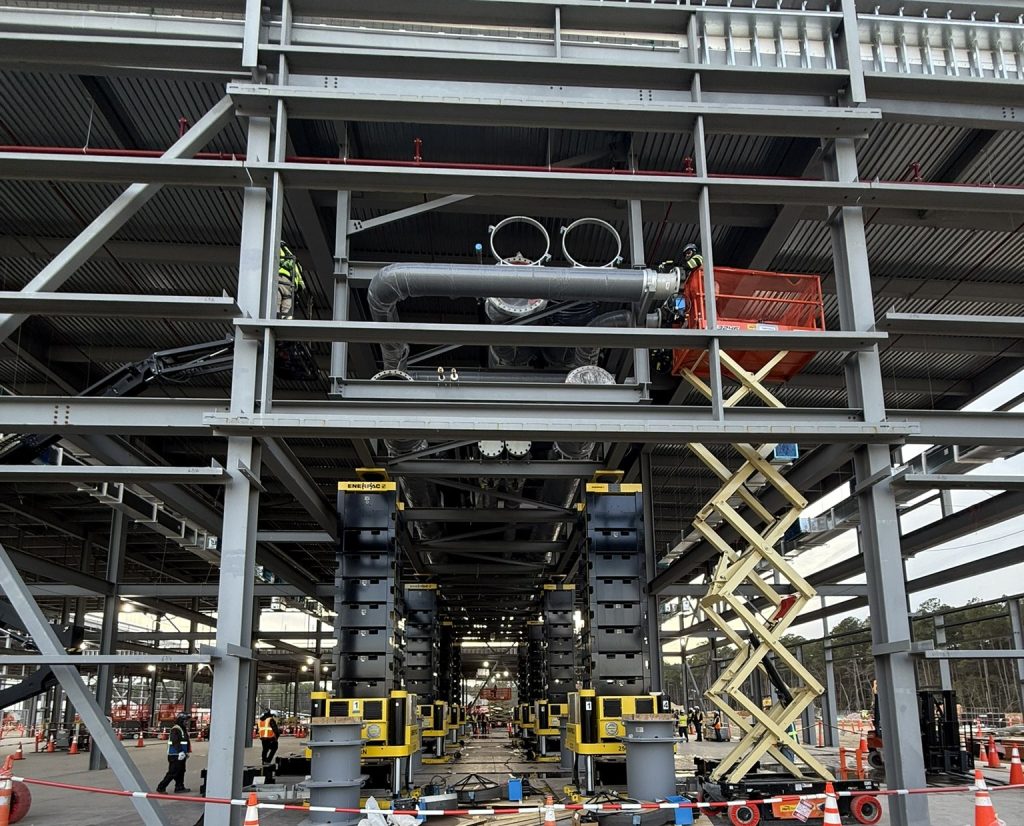 With the 245,000-pound pipe rack securely held in positioned by the eight-leg jack-up system, the crew mobilized to secure the pipe rack with bolts.