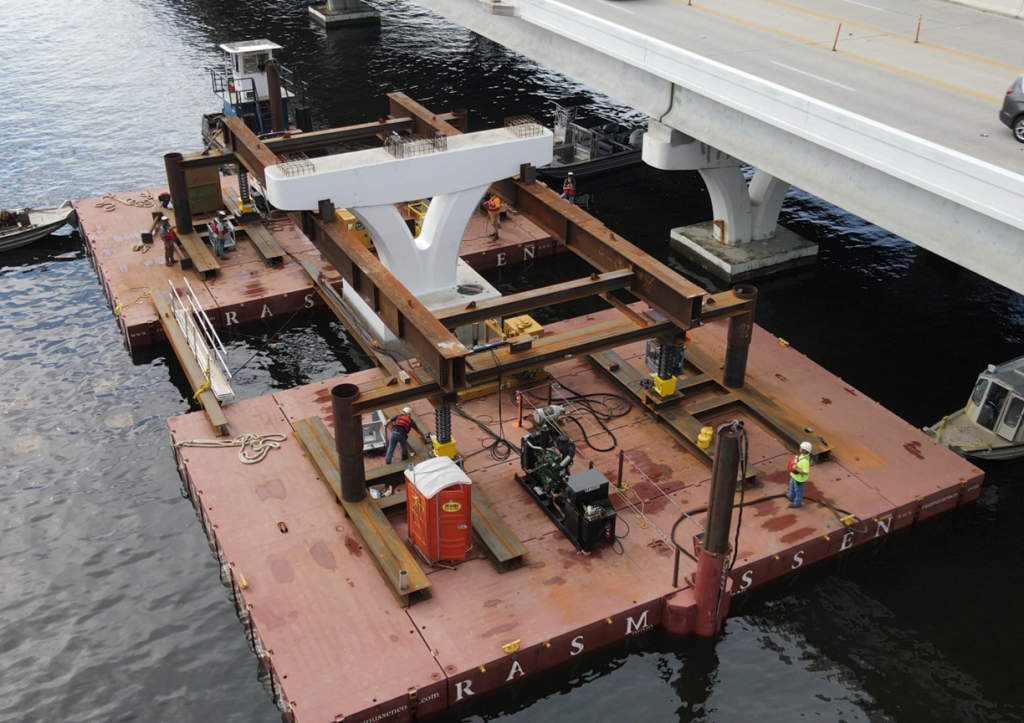 A cube jack system is used to hold a 135-ton bridge pier in place during bridge renovations.