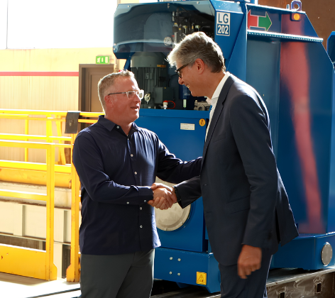 Christopher Cox, P.E., founder and president of Engineered Rigging shaking hands with CLP CEO Luca Giordano at CLP’s headquarters.